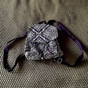 Black and white drawstring mini backpack.